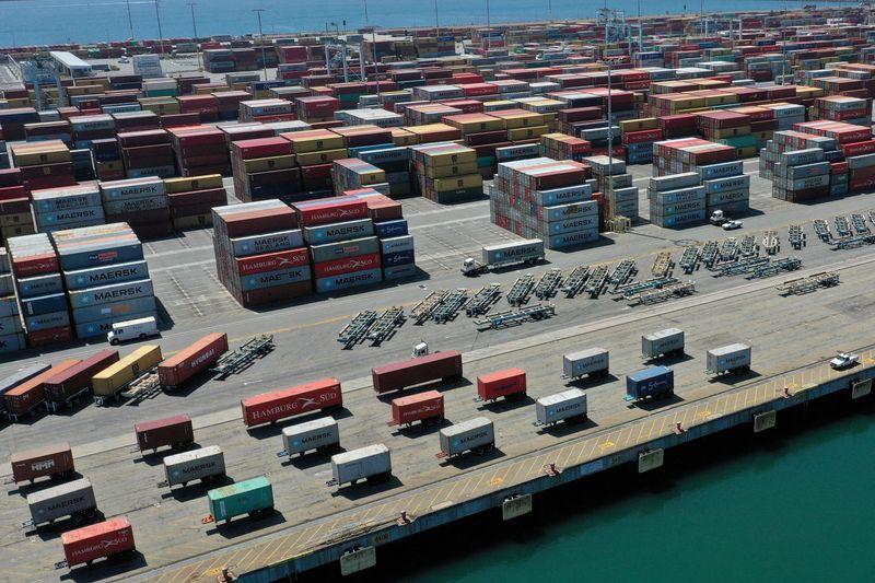 &copy; Reuters. FILE PHOTO: Containers are seen on a shipping dock, as the global outbreak of the coronavirus disease (COVID-19) continues, in the Port of Los Angeles, California, U.S., April 16, 2020.  REUTERS/Lucy Nicholson/File Photo