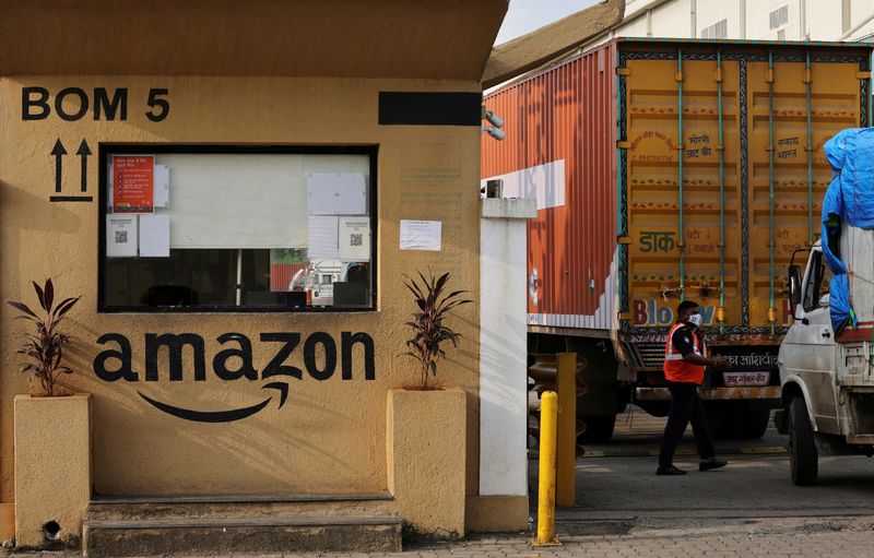 &copy; Reuters. FILE PHOTO: A man inspects trucks before they enter an Amazon storage facility on the outskirts of Mumbai, India, October 1, 2021. REUTERS/Francis Mascarenhas