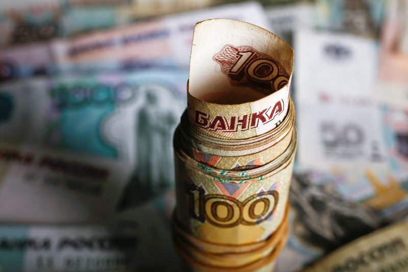 &copy; Reuters. FILE PHOTO: A picture illustration shows rolled Russian rouble banknotes on a table in Warsaw, Poland, January 22, 2016. REUTERS/Kacper Pempel/File Photo