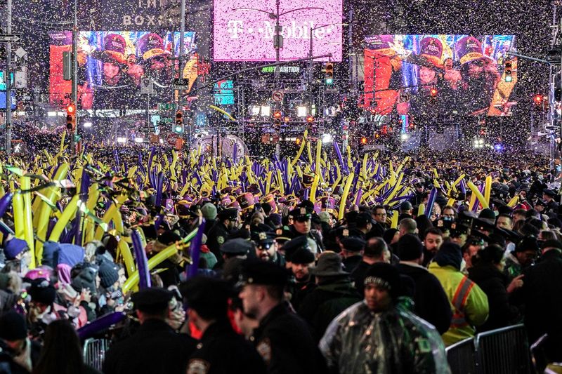 &copy; Reuters. FILE PHOTO: Revelers celebrate New Year's Eve in Times Square in the Manhattan borough of New York City, U.S., December 31, 2019.REUTERS/Jeenah Moon/File Photo