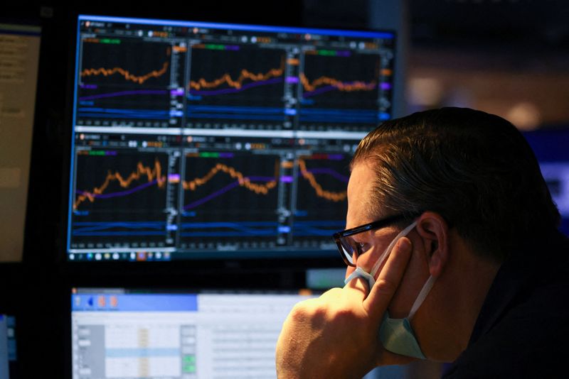 &copy; Reuters. FILE PHOTO: A trader works on the trading floor on the last day of trading before Christmas at the New York Stock Exchange (NYSE) in Manhattan, New York City, U.S., December 23, 2021. REUTERS/Andrew Kelly