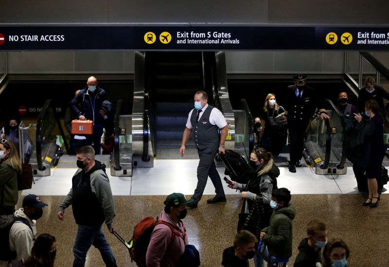 &copy; Reuters. FILE PHOTO: People enter the baggage claim area from the international arrivals terminal as the U.S. reopens air and land borders to coronavirus disease (COVID-19) vaccinated travellers for the first time since the COVID-19 restrictions were imposed, at S