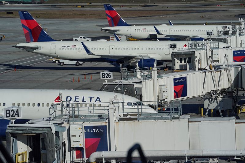 &copy; Reuters. FILE PHOTO: Delta Air Lines jets are seen at gates at Hartsfield-Jackson Atlanta International Airport in Atlanta, Georgia, U.S. December 22, 2021. REUTERS/Elijah Nouvelage/File Photo