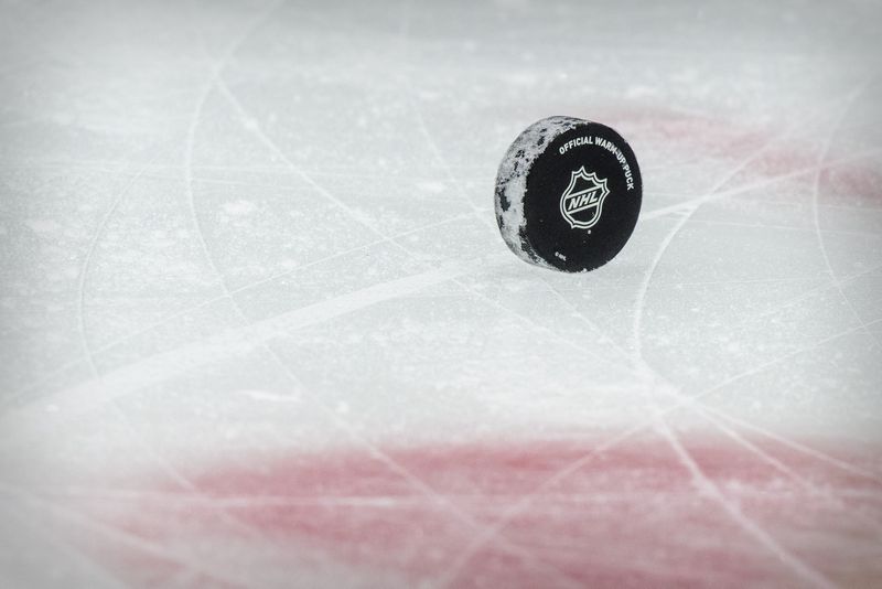 &copy; Reuters. FILE PHOTO: Jan 26, 2021; Dallas, Texas, USA; A view of a puck and the NHL logo and the face-off circle before the game between the Dallas Stars and the Detroit Red Wings at the American Airlines Center. Mandatory Credit: Jerome Miron-USA TODAY Sports