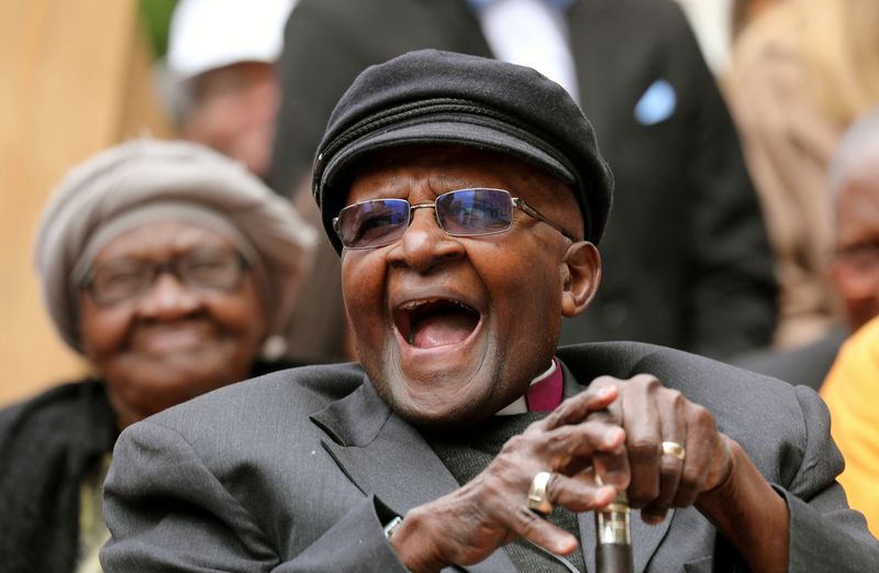 &copy; Reuters. FILE PHOTO: Archbishop Desmond Tutu laughs as crowds gather to celebrate his birthday by unveiling an arch in his honour outside St George's Cathedral in Cape Town, South Africa, October 7, 2017. REUTERS/Mike Hutchings    