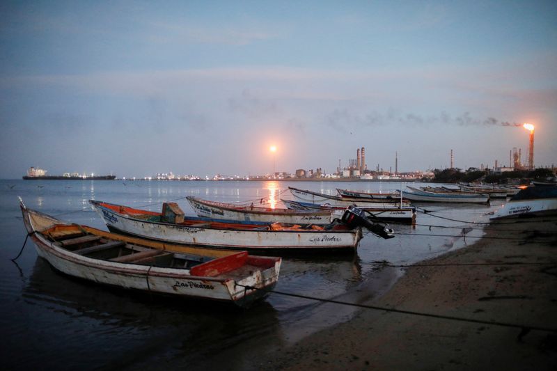 &copy; Reuters. FILE PHOTO-Fishing boats are moored down the coast from the Paraguana Refining Center (CRP) following a crude spill in September from a pipeline that connects production areas with the state-run PDVSA's largest refinery, in Punta Cardon, Venezuela October