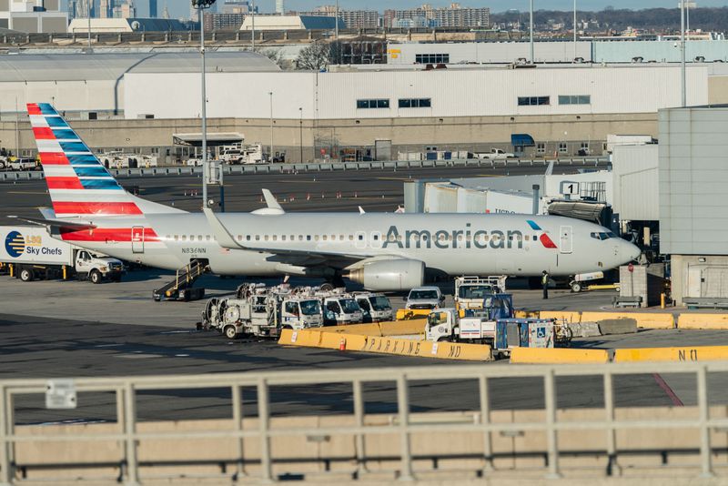 &copy; Reuters. FILE PHOTO: An American Airlines airplane is seen at John F. Kennedy International Airport during the spread of the Omicron coronavirus variant in Queens, New York City, U.S., December 26, 2021. REUTERS/Jeenah Moon