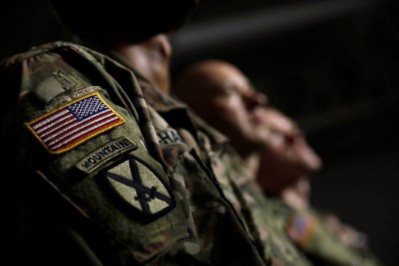 &copy; Reuters. FILE PHOTO: U.S. Army 10th Mountain Division soldiers listen as President Donald Trump speaks before signing the National Defense Authorization Act at Fort Drum, New York, U.S., August 13, 2018.  REUTERS/Carlos Barria