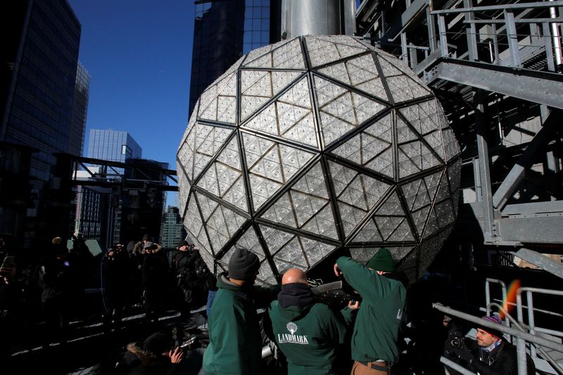 &copy; Reuters. Workers install Waterford Crystal triangles on the Times Square New Year's Eve Ball on the roof of One Times Square in Manhattan, New York, U.S., December 27, 2017.  REUTERS/Andrew Kelly