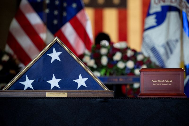 &copy; Reuters. FILE PHOTO: The remains of Capitol Police officer Brian Sicknick lay in honor in the Rotunda of the U.S. Capitol building after he died on Jan. 7 from injuries he sustained while protecting the U.S. Capitol during the Jan. 6 attack on the building, in Was