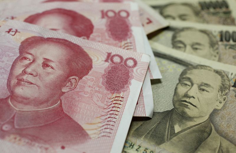 &copy; Reuters. １２月３１日、中国人民銀行（中央銀行）傘下の為替市場運営機関、中国外国為替取引システム（ＣＦＥＴＳ）は、２０２２年の主要人民元指数バスケットの構成を調整すると発表した。写