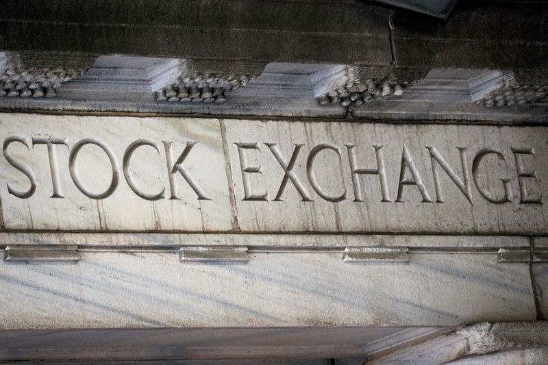 &copy; Reuters. FILE PHOTO: "Stock Exchange" is seen over an entrance to the New York Stock Exchange (NYSE) on Wall St. in New York City, U.S., March 29, 2021.  REUTERS/Brendan McDermid
