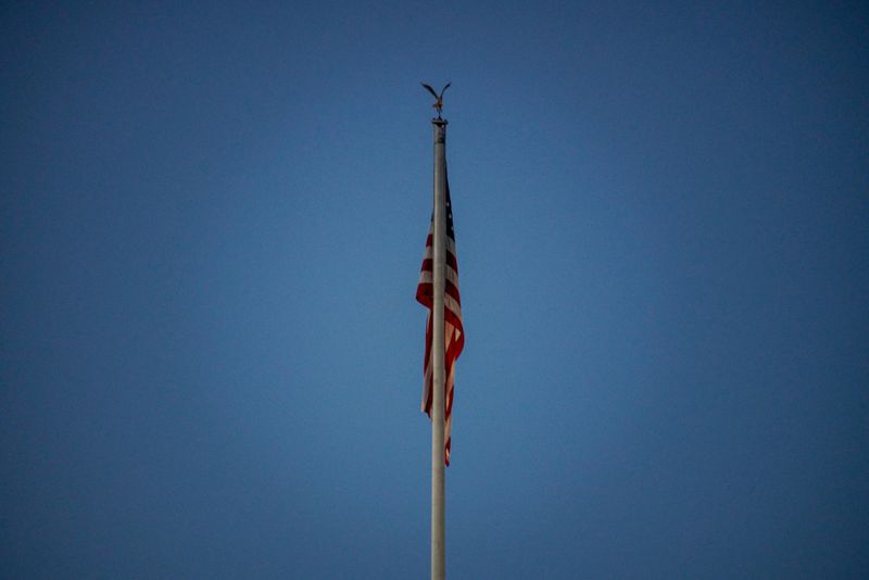 &copy; Reuters. U.S. flag atop the White House is pictured early in the morning after U.S. President Donald Trump was taken to hospital in the wake of his coronavirus disease (COVID-19) diagnosis, in Washington, D.C., U.S. October 3, 2020. REUTERS/Ken Cedeno     TPX IMAG