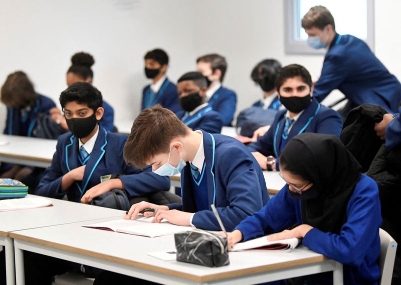 &copy; Reuters. FILE PHOTO: Year 9 students wear protective face masks as they take part in lessons on the first day back at school, as the coronavirus disease (COVID-19) lockdown begins to ease at Harris Academy Sutton, south London, Britain, March 8, 2021. REUTERS/Toby