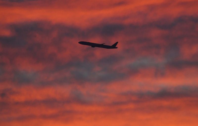 © Reuters. FILE PHOTO: A plane is seen shortly after take-off at sunset, from Heathrow Airport, London, Britain, December 11, 2020. REUTERS/Toby Melville