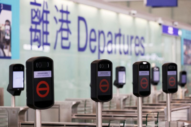 &copy; Reuters. FILE PHOTO: Closed counters are seen at the departures hall of Hong Kong International Airport, following the coronavirus disease (COVID-19) outbreak, in Hong Kong, China February 2, 2021. REUTERS/Tyrone Siu