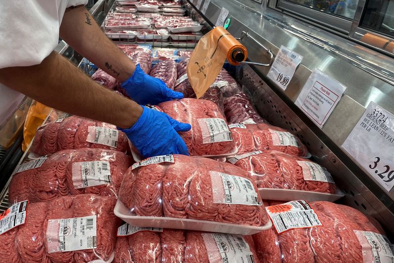 &copy; Reuters. FILE PHOTO: A worker stacks packets of ground beef in the meat section of a Costco warehouse club during the coronavirus disease (COVID-19) pandemic in Webster, Texas, U.S., May 5, 2020.  REUTERS/Adrees Latif