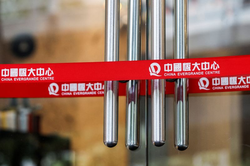 &copy; Reuters. FILE PHOTO: Logos of China Evergrande are seen on taps outside China Evergrande Centre building in Hong Kong, China December 7, 2021. REUTERS/Tyrone Siu