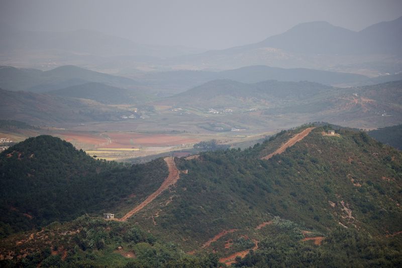 &copy; Reuters. FILE PHOTO: A general view of the North Korean guard posts, in this picture taken from the top of the Aegibong Peak Observatory, south of the demilitarised zone (DMZ), separating the two Koreas in Gimpo, South Korea, October 5, 2021. REUTERS/Kim Hong-Ji