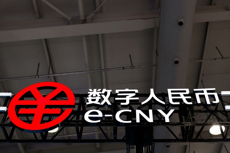 &copy; Reuters. FILE PHOTO: The sign of China's digital yuan, or e-CNY, is seen at the 2021 China International Fair for Trade in Services (CIFTIS) in Beijing, China September 3, 2021. REUTERS/Florence Lo