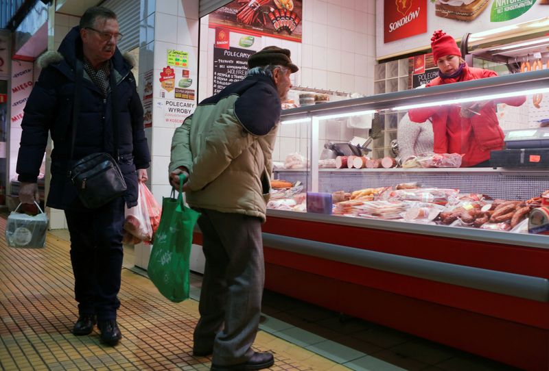 © Reuters. FILE PHOTO: A man looks at meat products at a market in Gdynia, Poland. January 31 2019. REUTERS/Matej Leskovsek