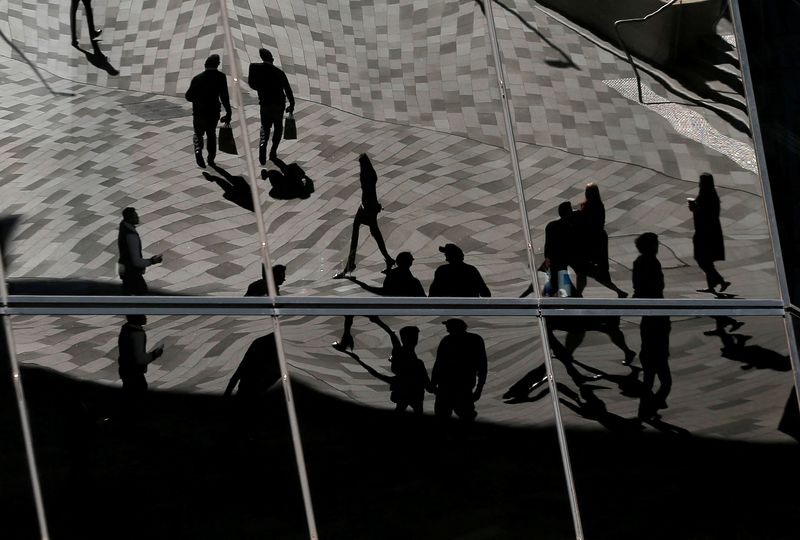 &copy; Reuters. FILE PHOTO: Workers are reflected in an office building's windows in Sydney's Barangaroo business district in Australia's largest city, May 8, 2017.  REUTERS/Jason Reed