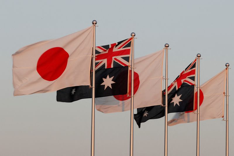 &copy; Reuters. Japanese and Australian flags are pictured before the arrival of Australian Prime Minister Scott Morrison at Haneda airport in Tokyo, Japan November 17, 2020.  REUTERS/Issei Kato