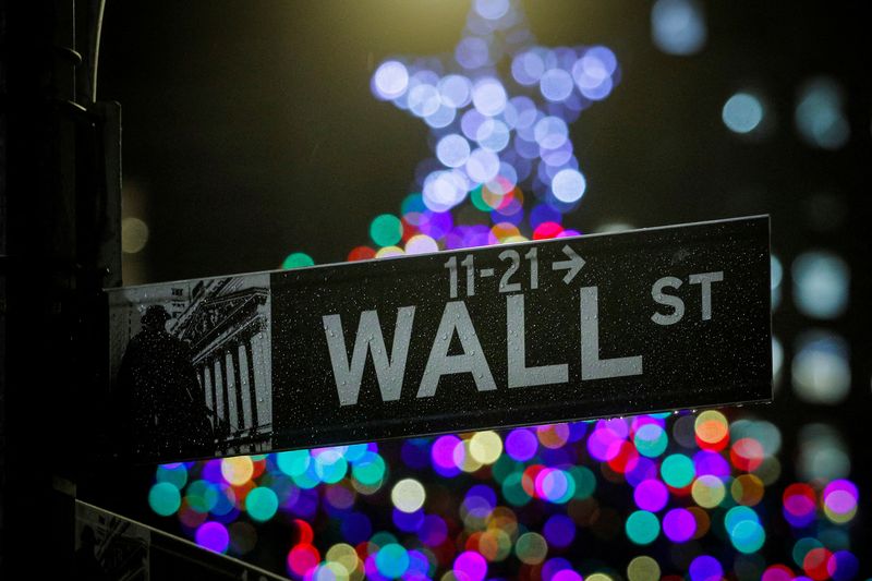 &copy; Reuters. FILE PHOTO: The Wall St. sign is seen outside the New York Stock Exchange (NYSE) in New York, U.S., December 17, 2019. REUTERS/Brendan McDermid/File Photo