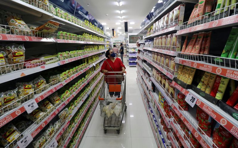 &copy; Reuters. FILE PHOTO: A woman shops inside the Big Bazaar retail store in Mumbai, India, November 25, 2020. REUTERS/Niharika Kulkarni