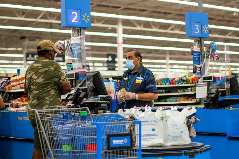 Walmart halves paid leave for COVID-positive workers