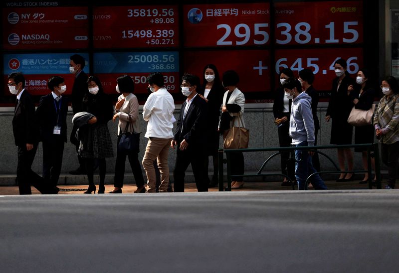 Asian stocks fall after Fed minutes point to faster rate hikes By Reuters