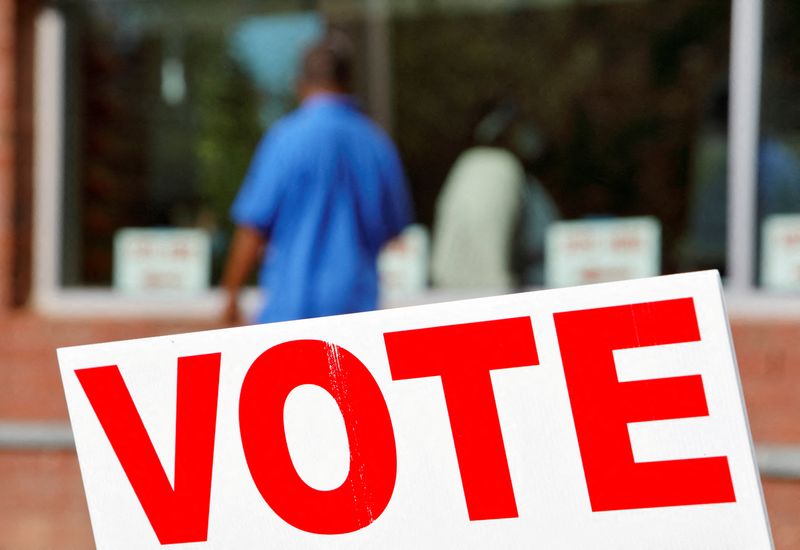 &copy; Reuters. FILE PHOTO: Signs direct voters into a polling station during the 2020 U.S. presidential election in Durham, Durham County, North Carolina, U.S., November 3, 2020.   REUTERS/Jonathan Drake/File Photo