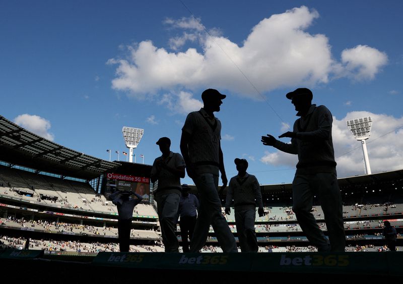&copy; Reuters. FILE PHOTO: Cricket - Ashes - Third Test - Australia v England - Melbourne Cricket Ground, Melbourne, Australia - December 27, 2021 Australia players walk off the pitch after the end of the day REUTERS/Loren Elliott