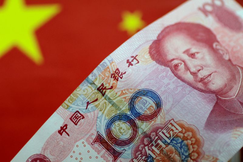 &copy; Reuters. FILE PHOTO: A China yuan note is seen in this illustration photo May 31, 2017.  REUTERS/Thomas White