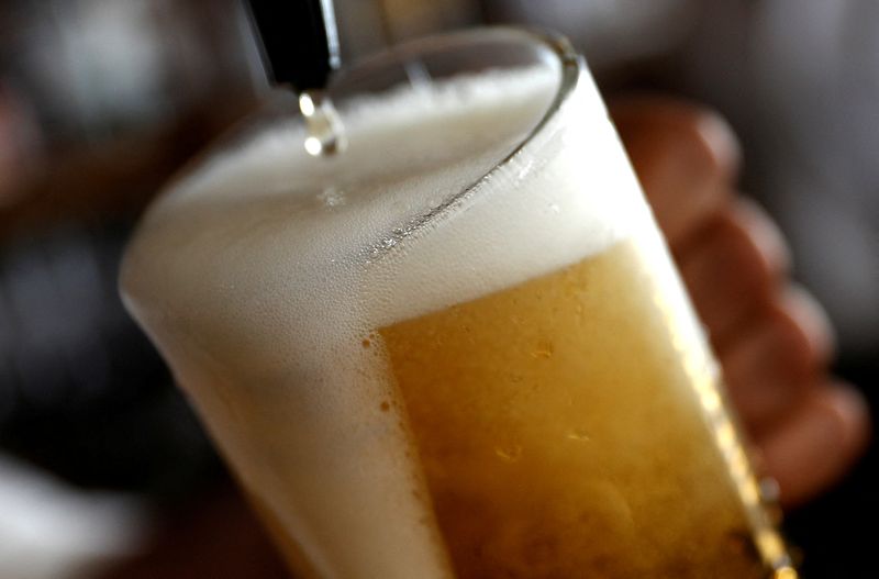 &copy; Reuters. FILE PHOTO: A pint of beer is poured into a glass in a bar in London, Britain June 27, 2018. REUTERS/Peter Nicholls/File Photo