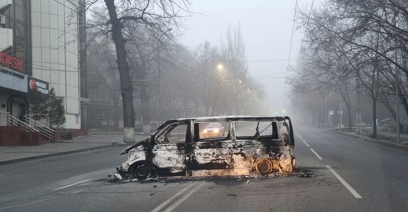 &copy; Reuters. A vehicle that was burned during the protests triggered by fuel price increase is seen on a road in Almaty, Kazakhstan January 6, 2022. REUTERS/Pavel Mikheyev