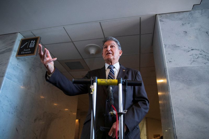 &copy; Reuters. FILE PHOTO: U.S. Senator Joe Manchin (D-WV) speaks to news reporters outside of his office in the Hart Senate Office Building on Capitol Hill in Washington, U.S., January 4, 2022. REUTERS/Tom Brenner