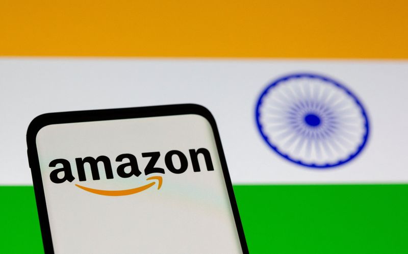 © Reuters. FILE PHOTO: Smartphone with Amazon logo is seen in front of displayed Indian flag in this illustration taken, July 30, 2021. REUTERS/Dado Ruvic/Illustration