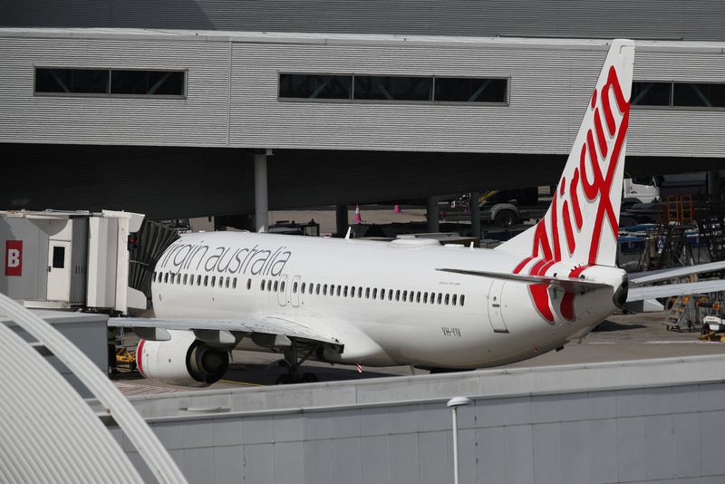 &copy; Reuters. FILE PHOTO: A Virgin Australia Airlines plane is seen at Kingsford Smith International Airport the morning after Australia implemented an entry ban on non-citizens and non-residents intended to curb the spread of the coronavirus disease (COVID-19) in Sydn