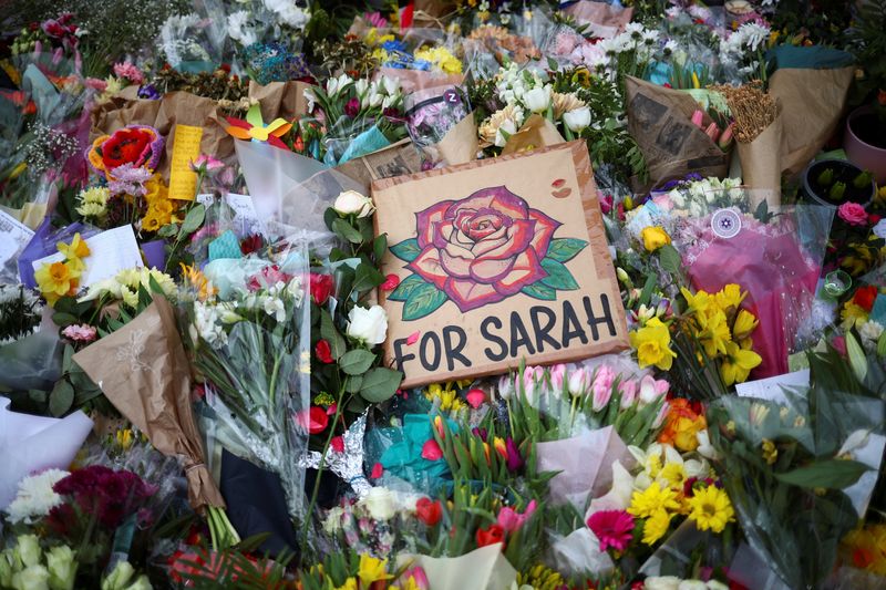 &copy; Reuters. FILE PHOTO: Flowers and messages are seen at a memorial site at the Clapham Common Bandstand, following the kidnap and murder of Sarah Everard, in London, Britain March 16, 2021. REUTERS/Hannah McKay