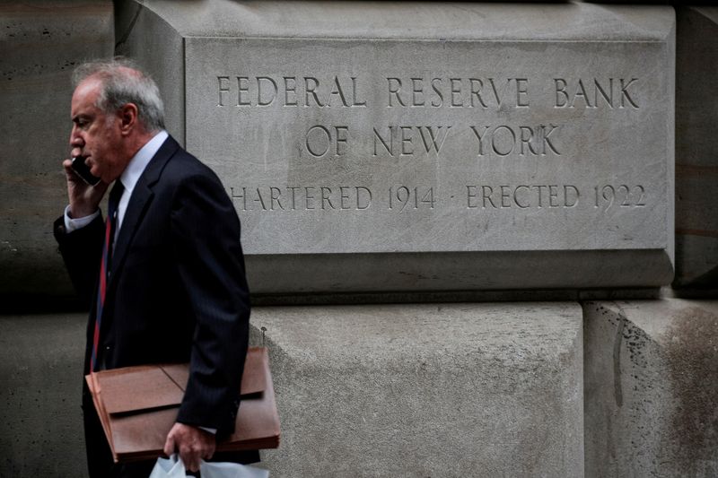 &copy; Reuters. FILE PHOTO: A man walks outside the Federal Reserve Bank of New York in New York City, U.S., October 12, 2021. REUTERS/Brendan McDermid