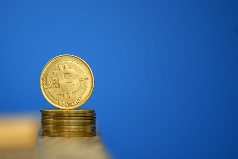 &copy; Reuters. FILE PHOTO: Bitcoin (virtual currency) coins are seen in an illustration picture taken at La Maison du Bitcoin in Paris July 11, 2014. REUTERS/Benoit Tessier 