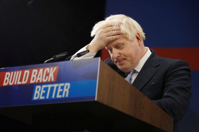 © Reuters. FILE PHOTO: Britain's Prime Minister Boris Johnson reacts as he delivers a speech during the annual Conservative Party Conference, in Manchester, Britain, October 6, 2021. REUTERS/Phil Noble