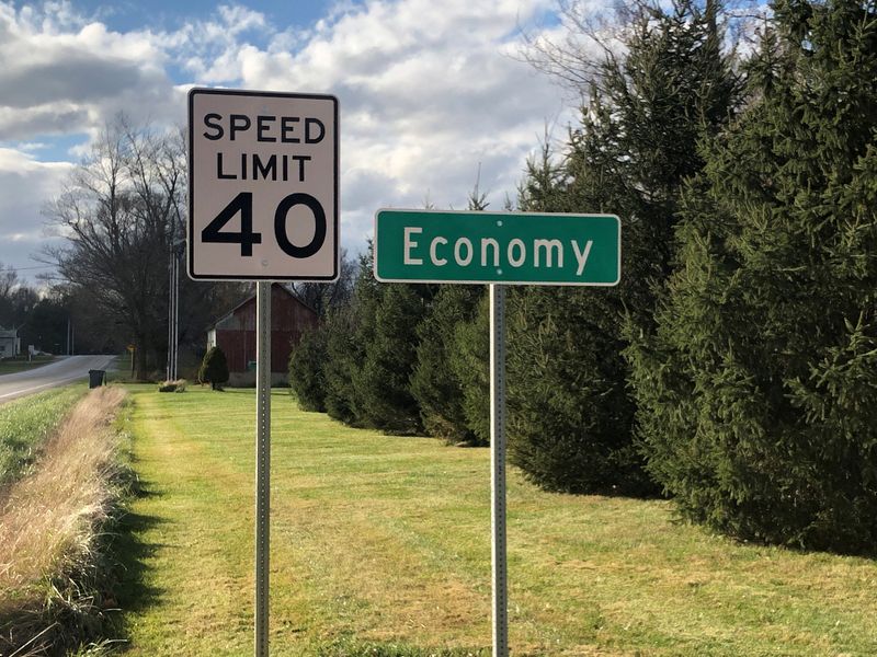 &copy; Reuters. FILE PHOTO: A speed limit sign is seen beside a city sign for Economy, Indiana, U.S., November 10, 2020. REUTERS/Timothy Aeppel