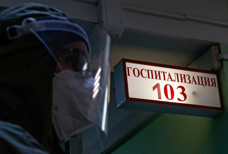 &copy; Reuters. A medical specialist is pictured at the City Clinical Hospital Number 52, where people suffering from the coronavirus disease (COVID-19) are treated, in Moscow, Russia October 21, 2021. The sign reads: "Hospitalization". REUTERS/Maxim Shemetov