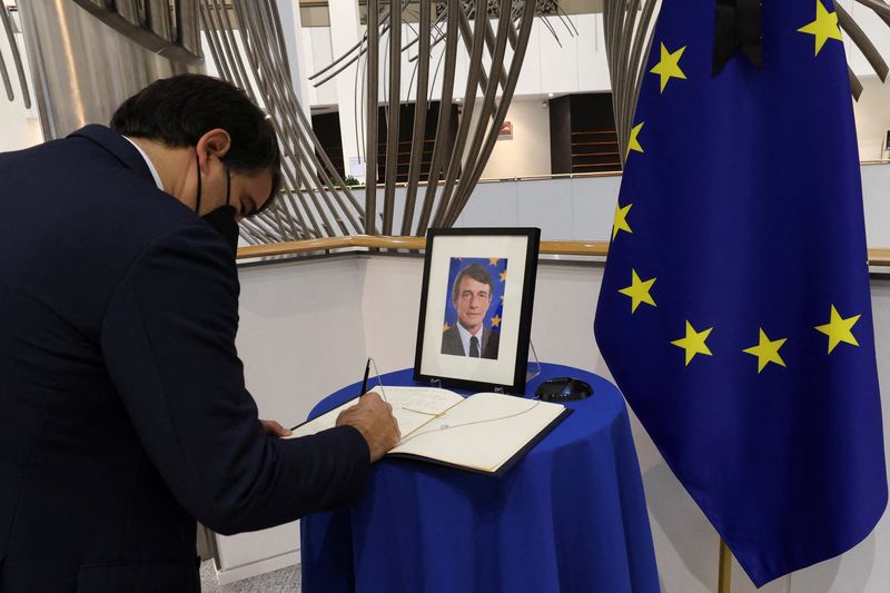 © Reuters. A man signs into a condolence book for late European Parliament President David Sassoli, at the European Parliament building, in Brussels, Belgium January 11, 2022. REUTERS/Yves Herman