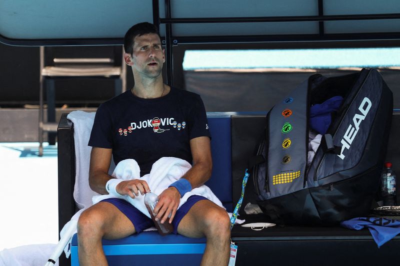 &copy; Reuters. Serbian tennis player Novak Djokovic rests at Melbourne Park as questions remain over the legal battle regarding his visa to play in the Australian Open in Melbourne, Australia, January 12, 2022.  REUTERS/Loren Elliott