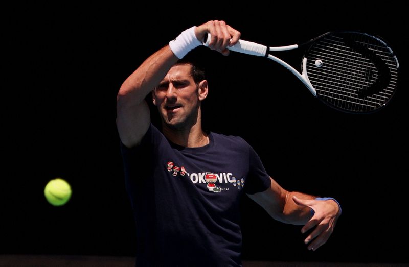 © Reuters. Serbian tennis player Novak Djokovic practices at Melbourne Park as questions remain over the legal battle regarding his visa to play in the Australian Open in Melbourne, Australia, January 12, 2022.  REUTERS/Loren Elliott