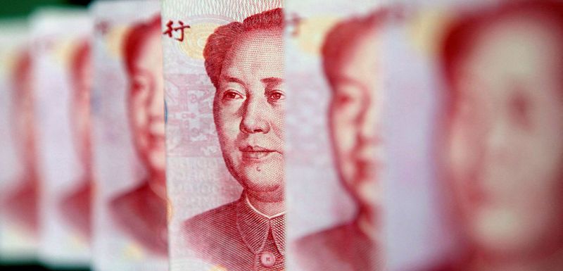 &copy; Reuters. FILE PHOTO: Yuan banknotes are seen in this illustrative photograph taken in Beijing July 26, 2010. REUTERS/Jason Lee/File Photo