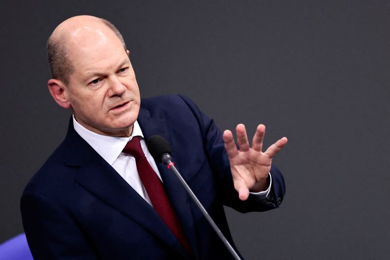 &copy; Reuters. German Chancellor Olaf Scholz speaks during his first questioning session with lawmakers at the lower house of parliament Bundestag in Berlin, Germany, January 12, 2022. REUTERS/Hannibal Hanschke